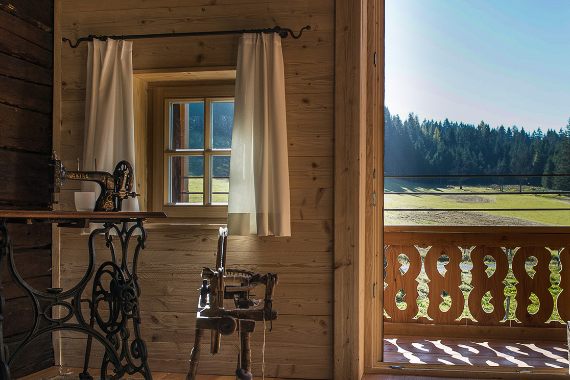 Old sewing machine on the window as a decoration in the Alpenachalet